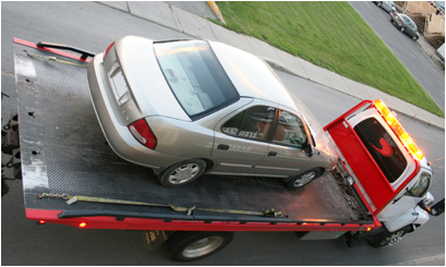 Car Being Towed on Flatbed Truck in Tampa, FL